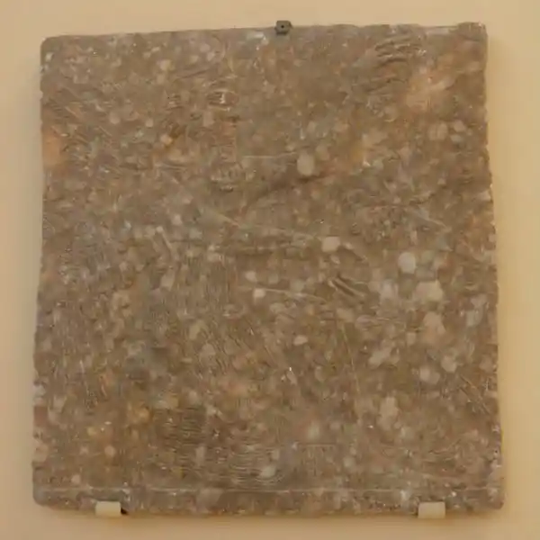 Genie - a winged man kneeling in front a tree of life Genie - a winged man kneeling in front a tree of life